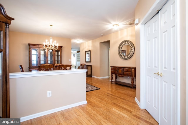 83 Huntington Dr, Jackson, NJ 08527 - kitchen featuring light wood-type flooring, baseboards, an inviting chandelier, and hanging light fixtures