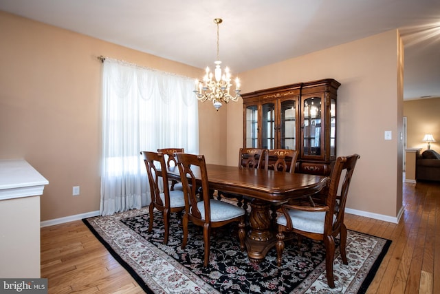 83 Huntington Dr, Jackson, NJ 08527 - dining space with light wood-style flooring, baseboards, and a chandelier