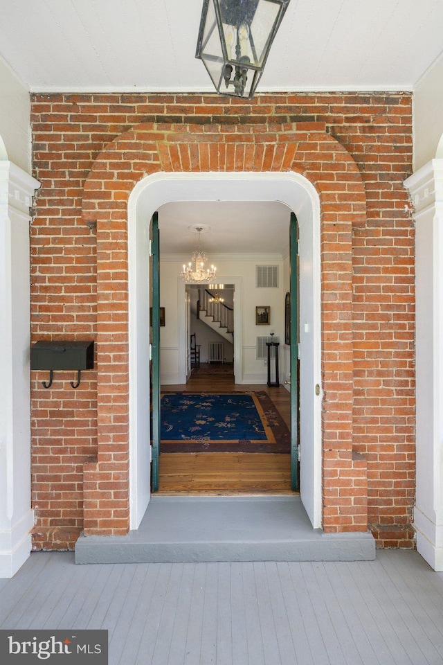 entrance to property with brick siding