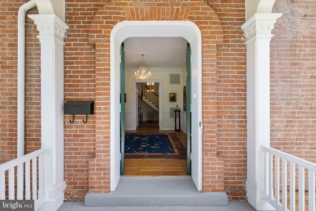entrance to property with brick siding