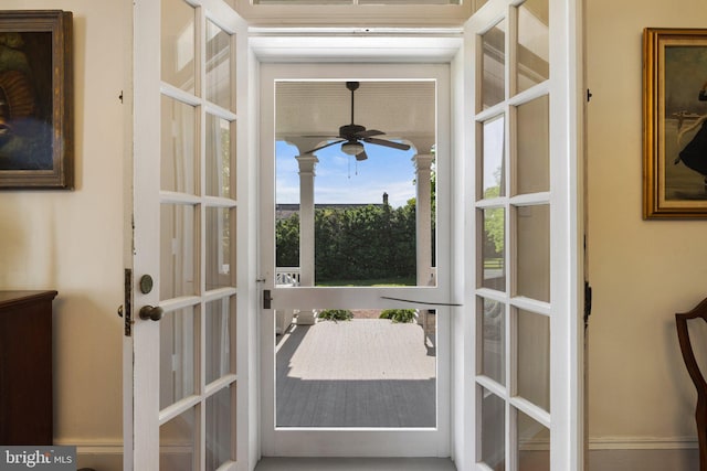 doorway to outside featuring ceiling fan