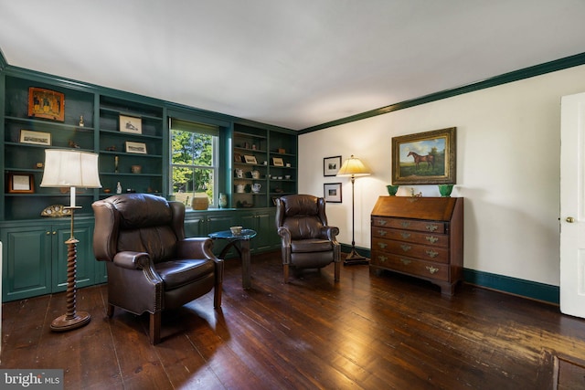 living area featuring wood-type flooring, crown molding, built in features, and baseboards