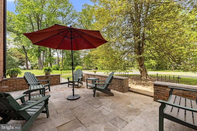 view of patio / terrace featuring view of scattered trees