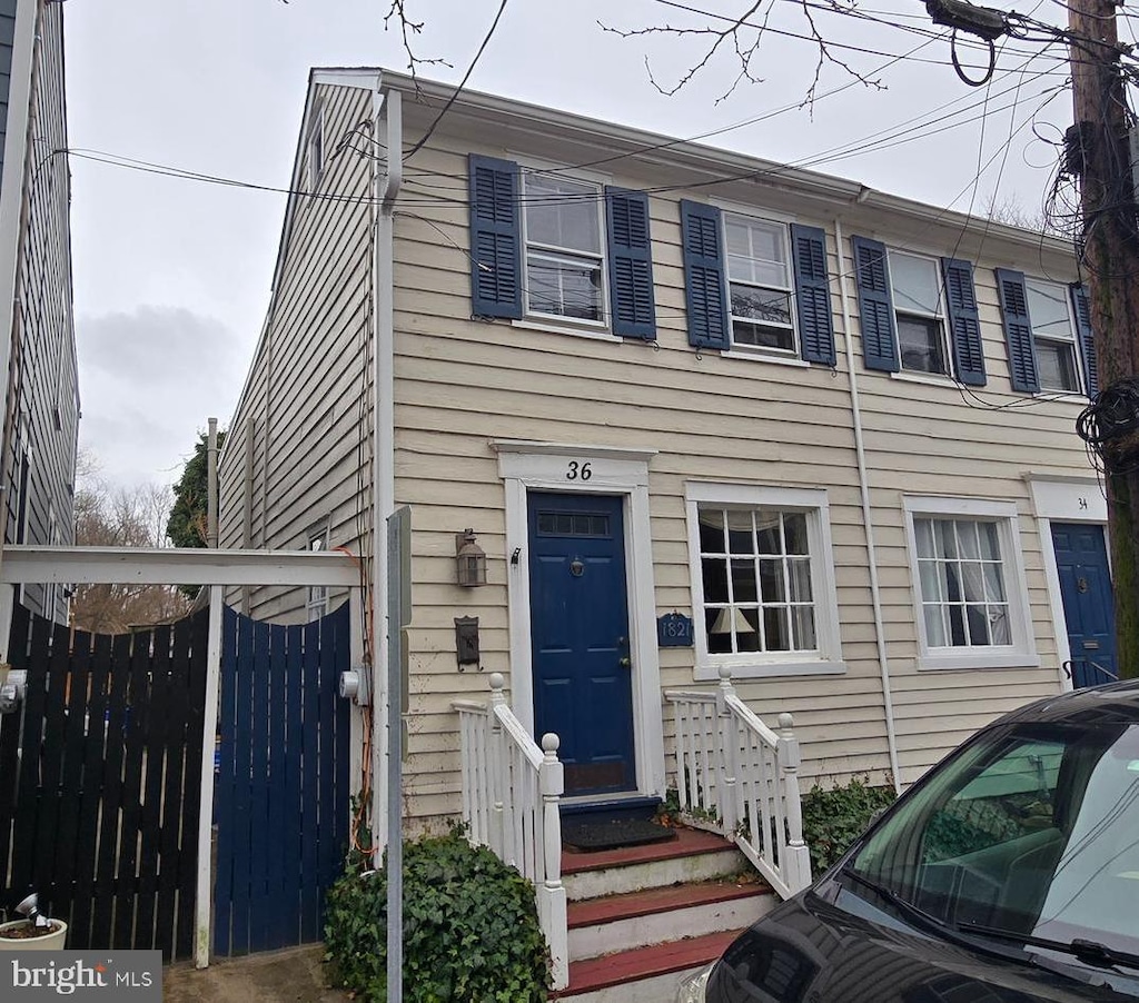 view of property with fence