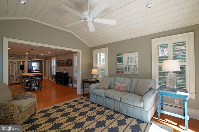 living room featuring ceiling fan, baseboards, wooden ceiling, wood finished floors, and lofted ceiling