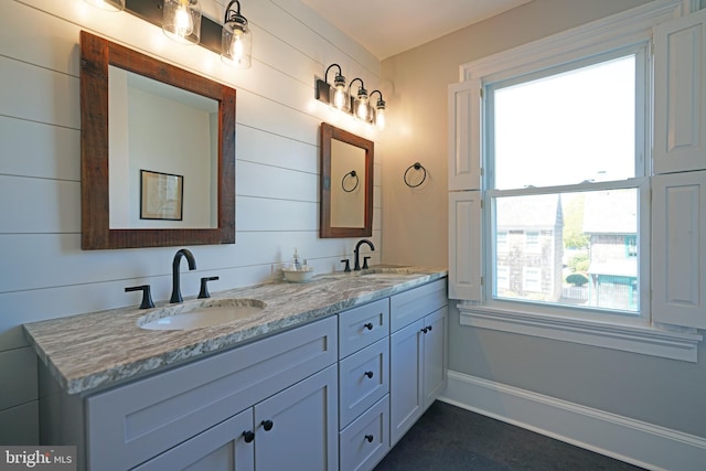 bathroom with double vanity and a sink