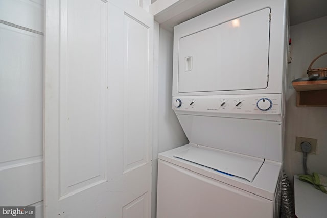 laundry room featuring laundry area and stacked washer and dryer