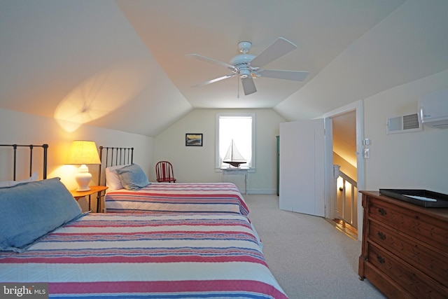 carpeted bedroom featuring an AC wall unit, a ceiling fan, baseboards, lofted ceiling, and visible vents