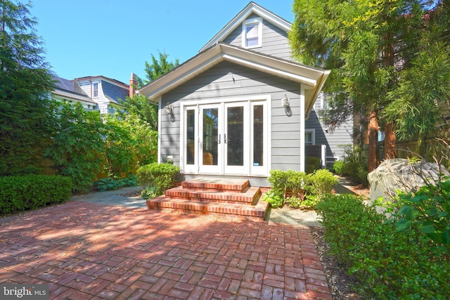 back of house featuring french doors