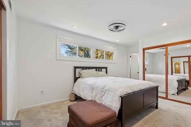 bedroom with recessed lighting, a closet, baseboards, and carpet