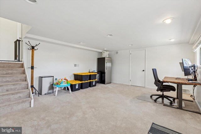 home office with light carpet and visible vents
