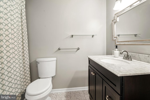full bath with baseboards, toilet, and vanity
