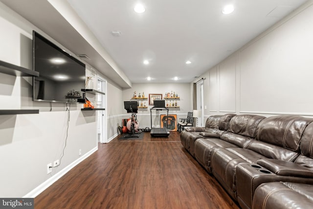 living room with recessed lighting, visible vents, and dark wood finished floors