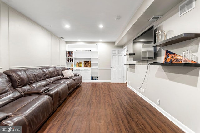 living area with dark wood finished floors, recessed lighting, baseboards, and visible vents