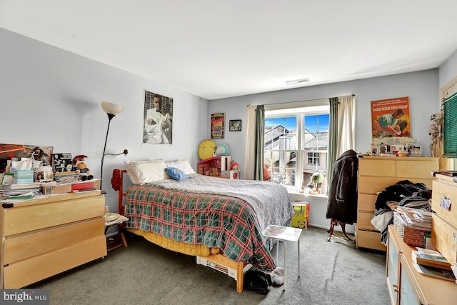 bedroom with visible vents and carpet floors