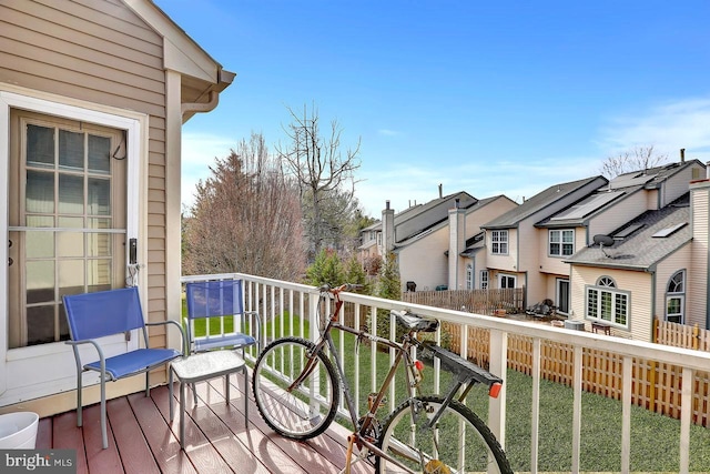 wooden terrace with a residential view