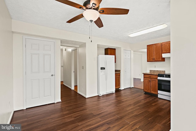 kitchen featuring electric range oven, white fridge with ice dispenser, brown cabinets, ceiling fan, and dark wood-type flooring
