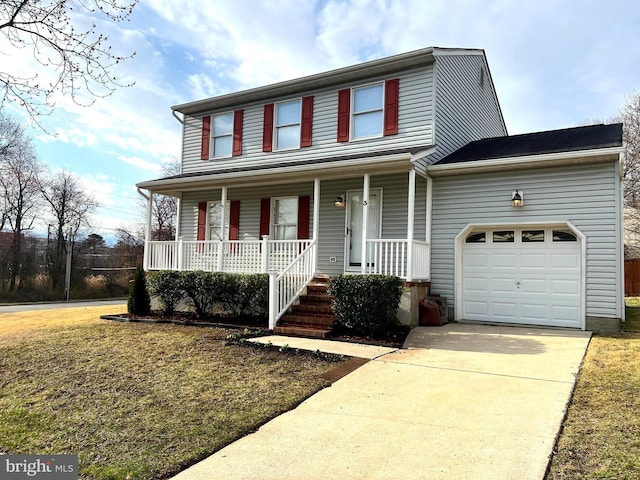 traditional home featuring driveway, covered porch, and a garage