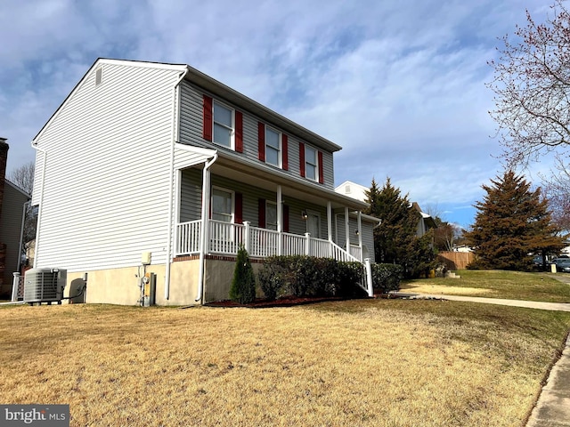 view of front of home with a porch, central air condition unit, and a front lawn