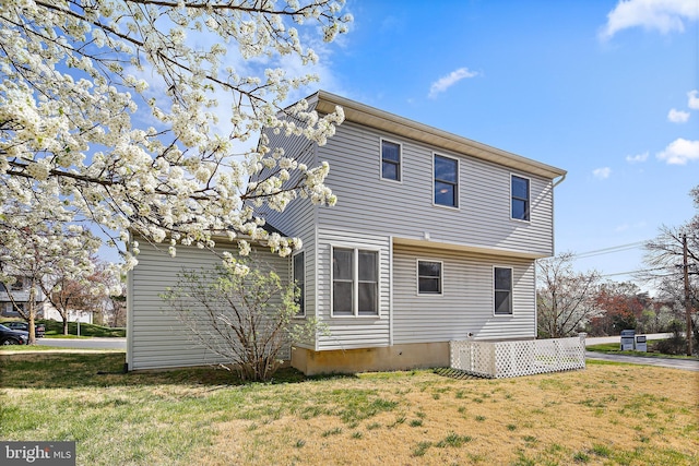back of property with a yard