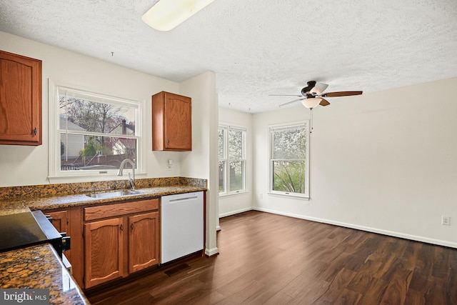 kitchen featuring a sink, ceiling fan, dishwasher, and dark wood-style flooring