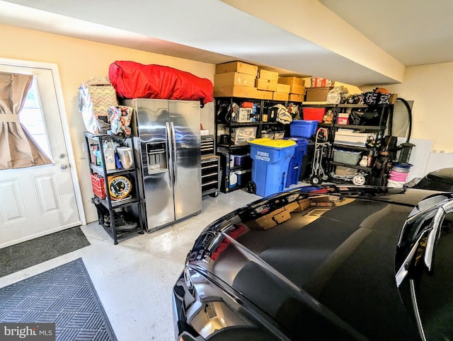 garage featuring stainless steel fridge