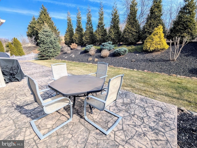 view of patio / terrace featuring outdoor dining area and fence