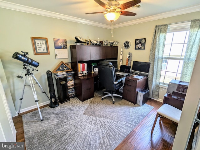 office space with baseboards, crown molding, ceiling fan, and wood finished floors