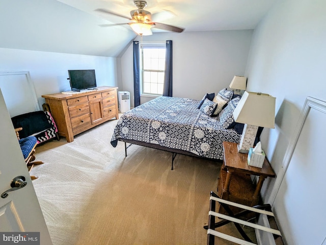 bedroom with light colored carpet, ceiling fan, and vaulted ceiling