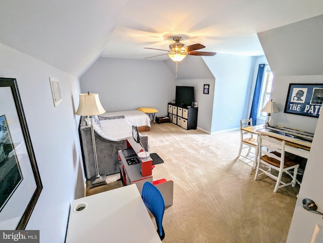 interior space featuring vaulted ceiling, baseboards, and ceiling fan