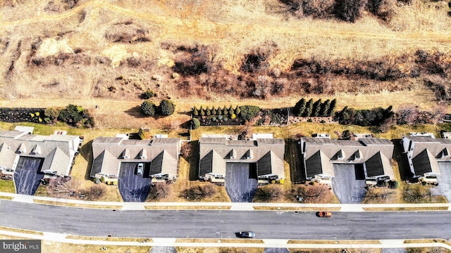 birds eye view of property with a residential view