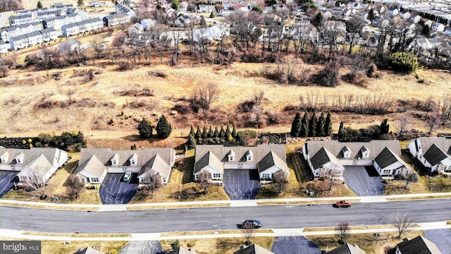 birds eye view of property with a residential view