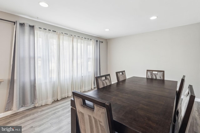 dining space featuring recessed lighting and light wood-style floors