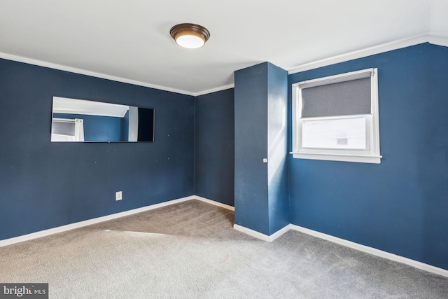 unfurnished room featuring carpet flooring and baseboards