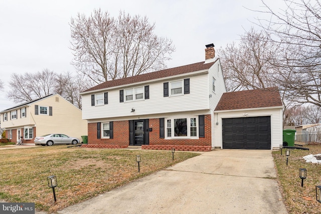 colonial home featuring a front lawn, concrete driveway, an attached garage, brick siding, and a chimney