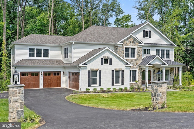3006 Weber Pl, Oakton, VA 22124 - craftsman-style house with a garage, driveway, a front lawn, a standing seam roof, and roof with shingles