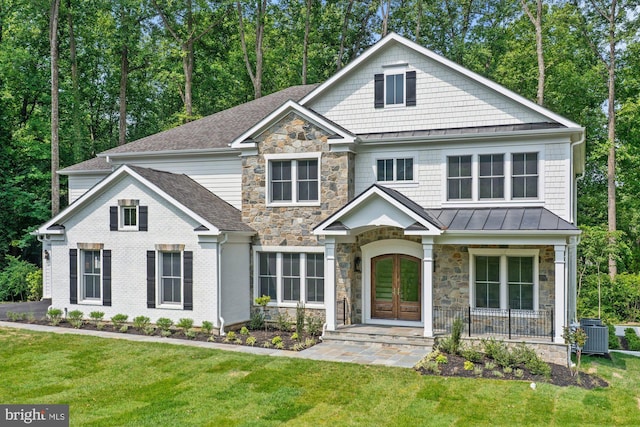 3006 Weber Pl, Oakton, VA 22124 - craftsman inspired home featuring a standing seam roof, stone siding, french doors, and a front lawn