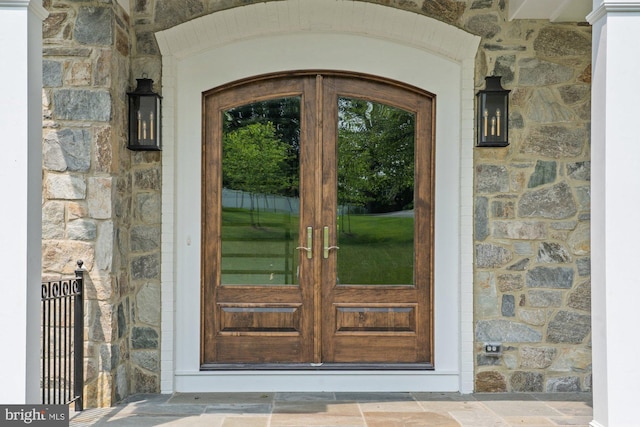 3006 Weber Pl, Oakton, VA 22124 - property entrance featuring stone siding and french doors
