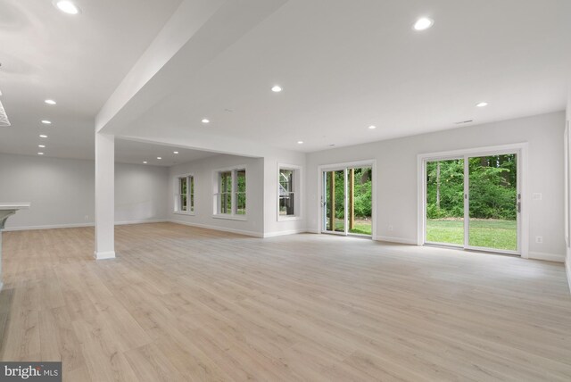 3006 Weber Pl, Oakton, VA 22124 - unfurnished living room featuring baseboards, plenty of natural light, light wood-style flooring, and recessed lighting