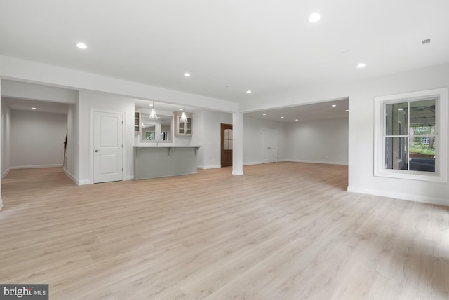3006 Weber Pl, Oakton, VA 22124 - unfurnished living room with baseboards, light wood-type flooring, and recessed lighting