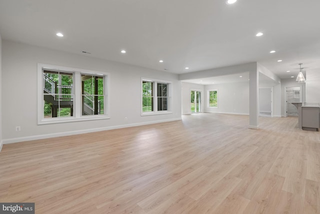 3006 Weber Pl, Oakton, VA 22124 - unfurnished living room featuring recessed lighting, baseboards, and light wood finished floors