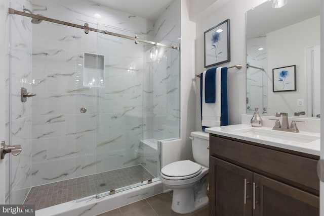 3006 Weber Pl, Oakton, VA 22124 - full bath featuring toilet, a marble finish shower, vanity, and tile patterned floors