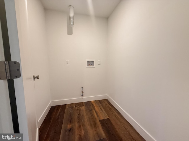 laundry area with baseboards, washer hookup, dark wood finished floors, and laundry area