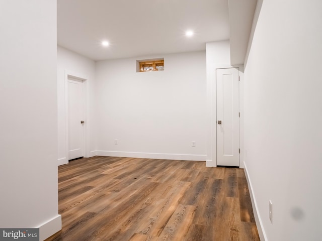 interior space with recessed lighting, baseboards, and wood finished floors