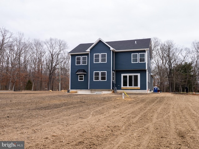 back of property featuring cooling unit