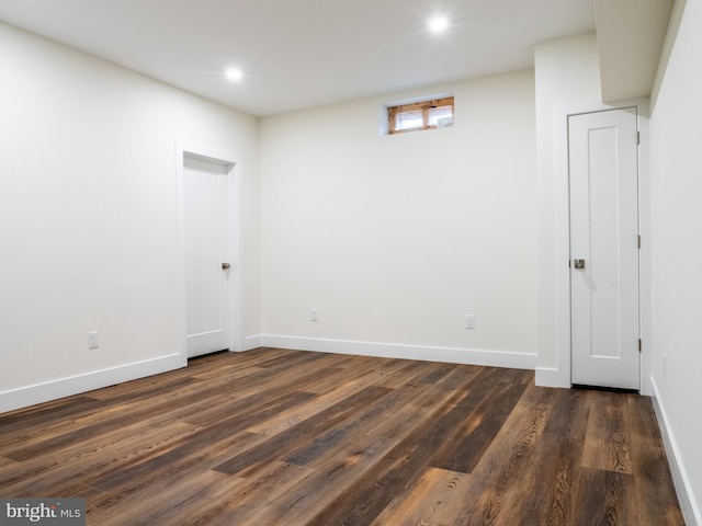 interior space with dark wood finished floors, recessed lighting, and baseboards