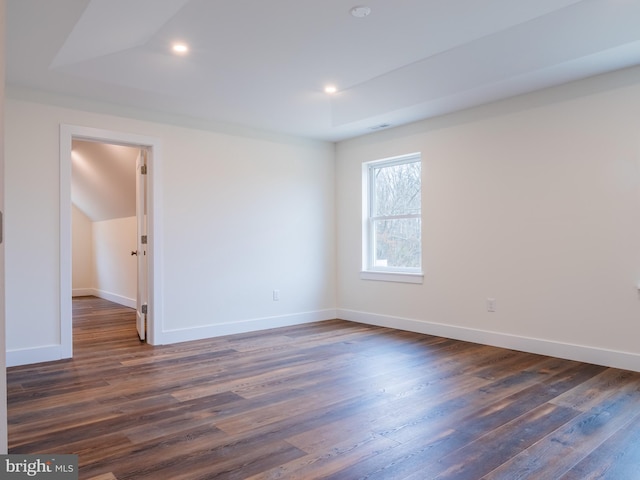 unfurnished room featuring recessed lighting, baseboards, and dark wood-type flooring