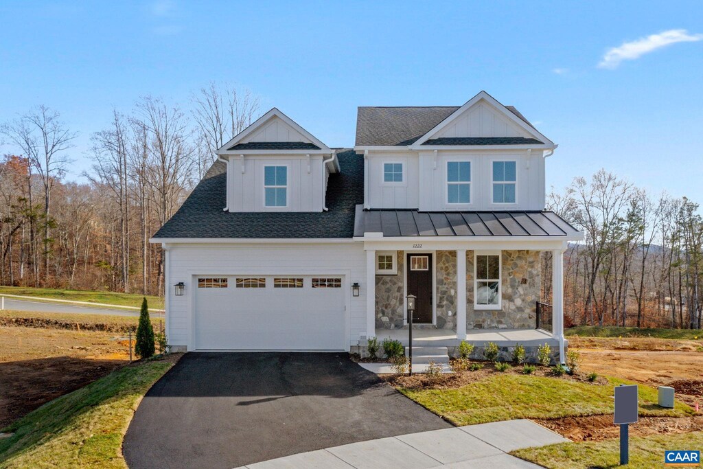 1222 Laconia Ln, Charlottesville, VA 22911 - view of front facade featuring stone siding, aphalt driveway, board and batten siding, and a porch