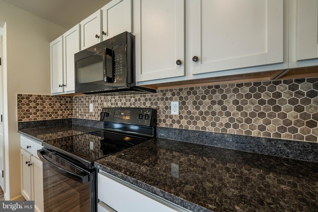 kitchen featuring tasteful backsplash, dark stone countertops, white cabinetry, and black appliances