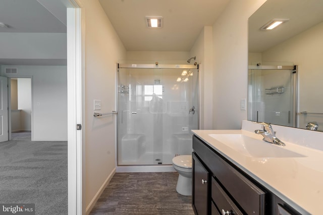 full bath featuring visible vents, a shower stall, toilet, and vanity